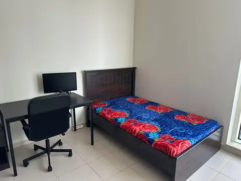 Double bed and work desk with monitor in the living room