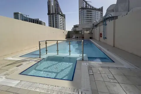 Rooftop pool with sun loungers